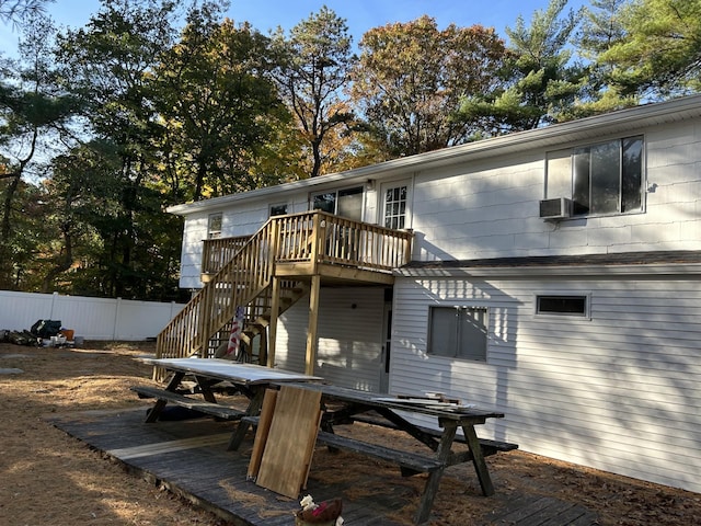 back of house with a deck