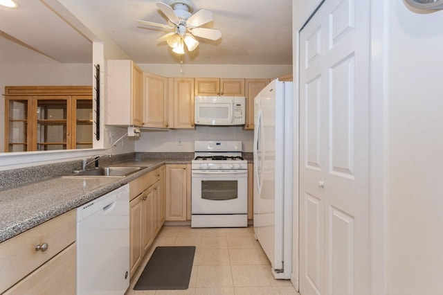 kitchen featuring light brown cabinetry, sink, light tile patterned floors, ceiling fan, and white appliances