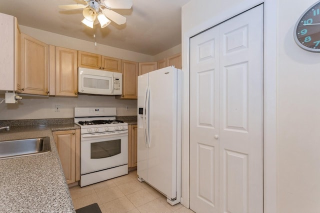 kitchen featuring light tile patterned flooring, light brown cabinetry, sink, ceiling fan, and white appliances