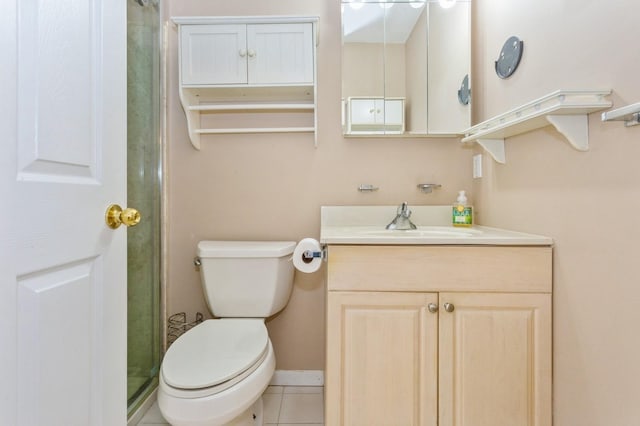 bathroom with vanity, a shower, tile patterned floors, and toilet