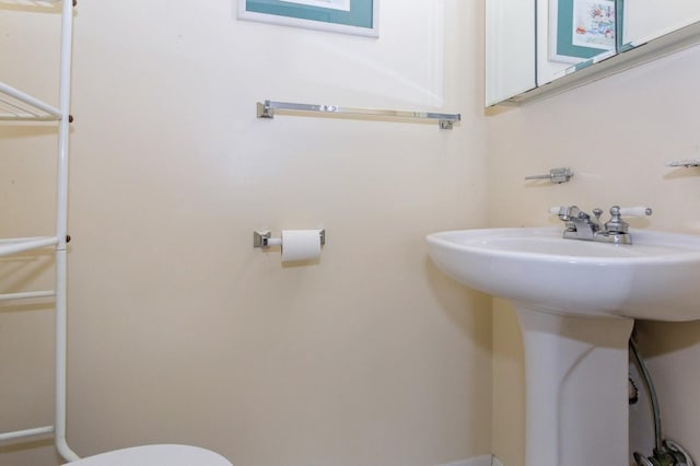 bathroom with toilet and sink