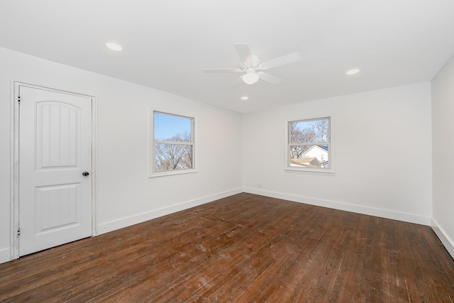 unfurnished room featuring ceiling fan and dark hardwood / wood-style flooring