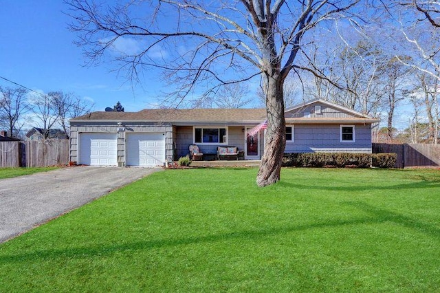 single story home featuring a garage and a front lawn