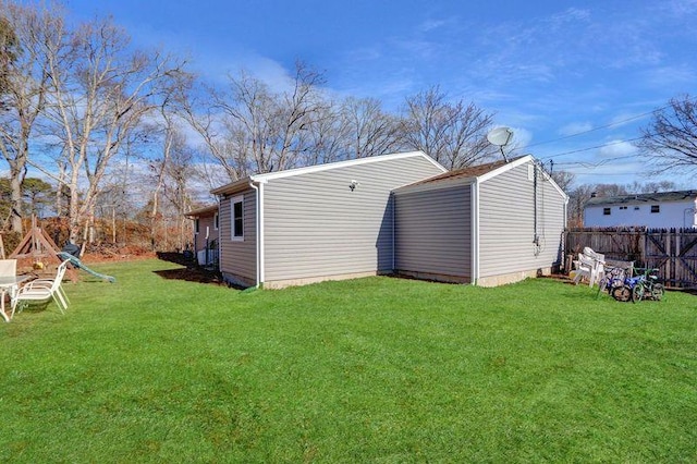 view of outbuilding featuring a lawn