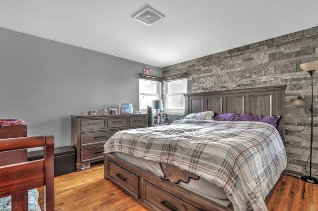 bedroom with light hardwood / wood-style floors