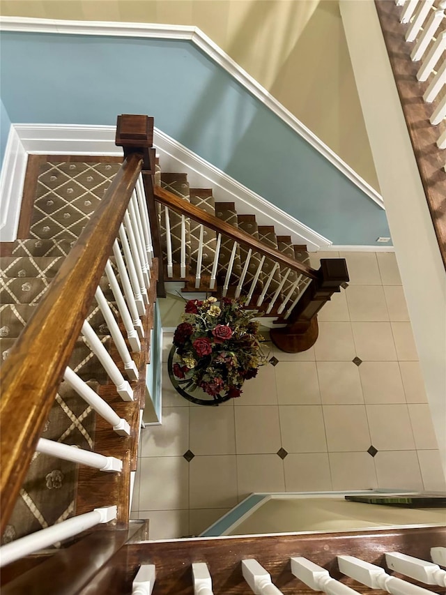 staircase featuring tile patterned floors