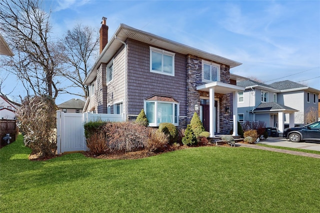 view of front of home with a front yard