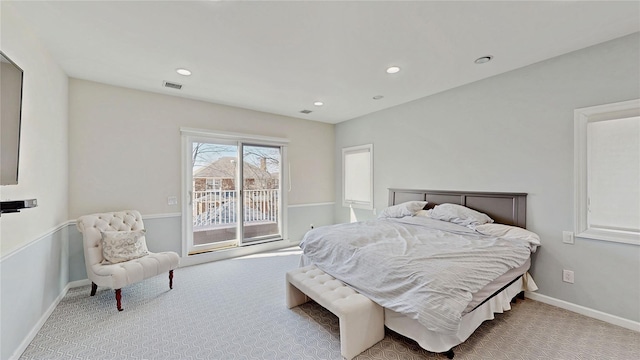 bedroom featuring light colored carpet and access to exterior