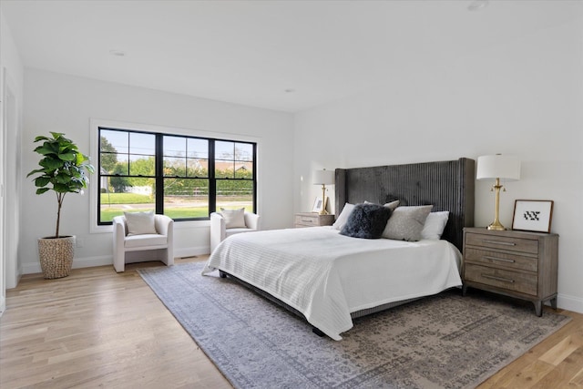 bedroom with light wood-type flooring