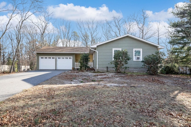 ranch-style home featuring a garage