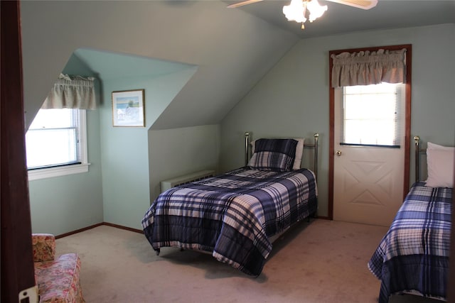 bedroom featuring ceiling fan, light colored carpet, and lofted ceiling