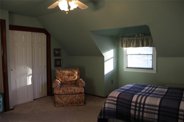 carpeted bedroom with vaulted ceiling and ceiling fan