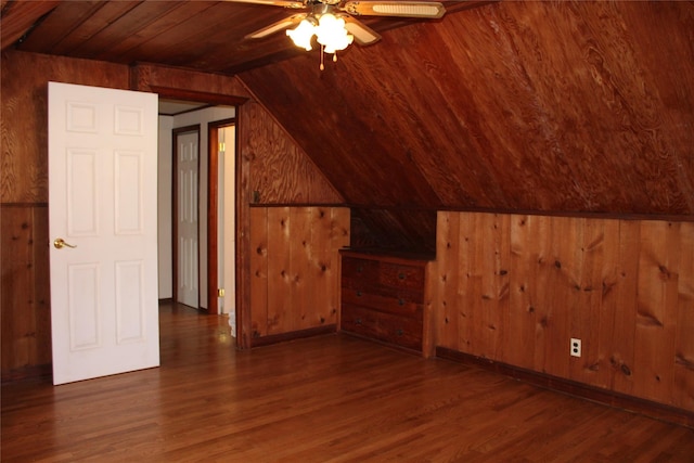 bonus room featuring wood ceiling, lofted ceiling, dark hardwood / wood-style flooring, and wood walls