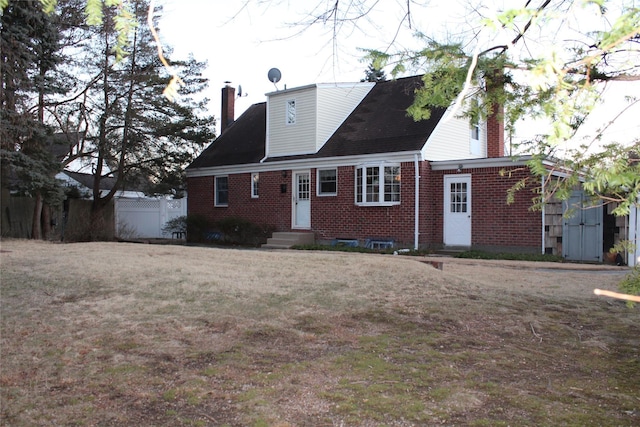 back of house with a yard