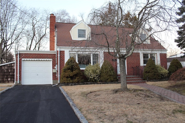 cape cod-style house with a garage