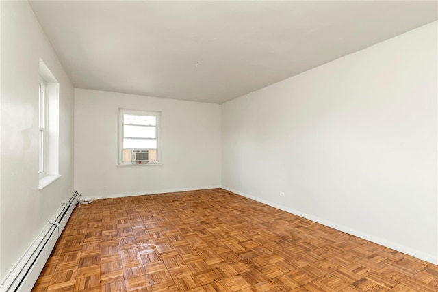 unfurnished room with a baseboard radiator and cooling unit