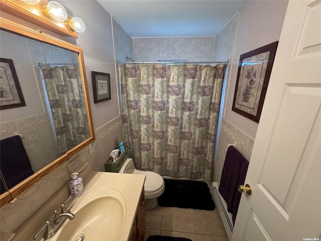 bathroom with tile walls, vanity, toilet, tile patterned floors, and a shower with shower curtain