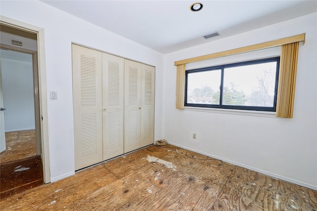 unfurnished bedroom with a closet