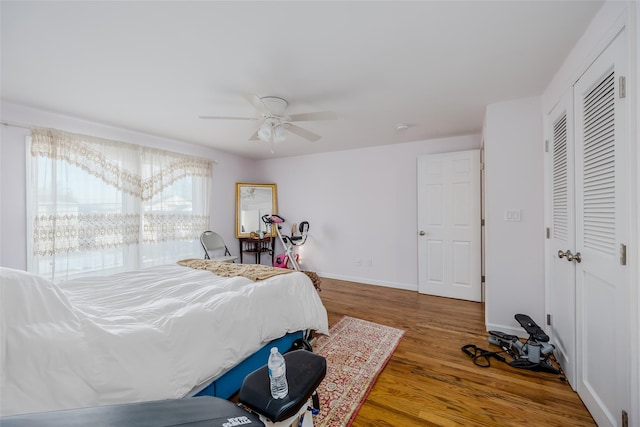 bedroom with hardwood / wood-style flooring and ceiling fan