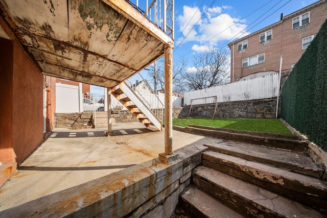 view of patio featuring fence