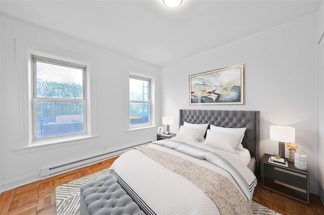 bedroom featuring parquet flooring and baseboard heating