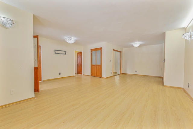 spare room featuring light hardwood / wood-style flooring