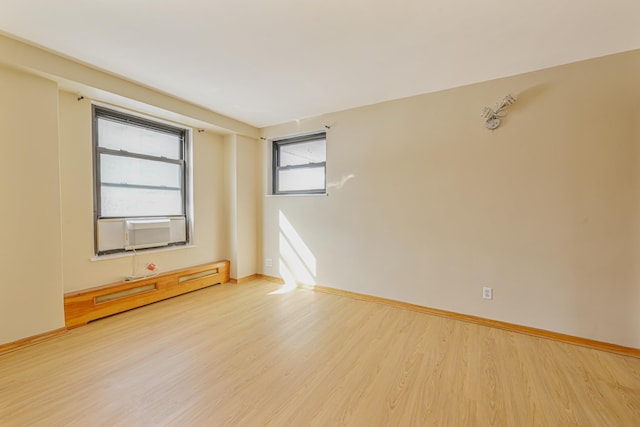 spare room with hardwood / wood-style floors