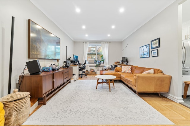 living room featuring ornamental molding and light parquet floors