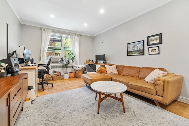 living room featuring crown molding and light parquet floors