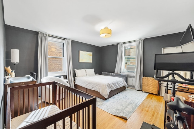 bedroom with light hardwood / wood-style flooring