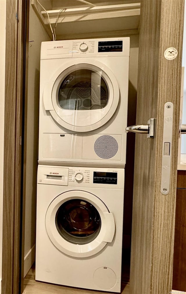 washroom with stacked washer and dryer