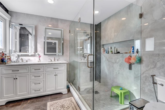 bathroom featuring vanity, toilet, and walk in shower