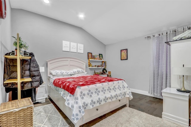 bedroom featuring lofted ceiling and hardwood / wood-style floors