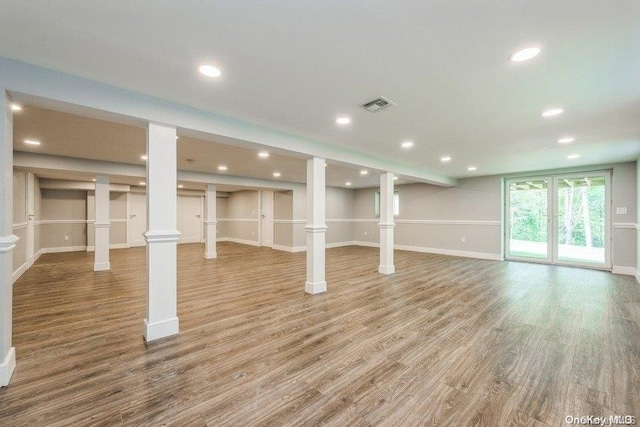 basement with hardwood / wood-style floors