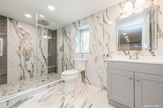 bathroom featuring vanity, tiled shower, tile walls, and toilet