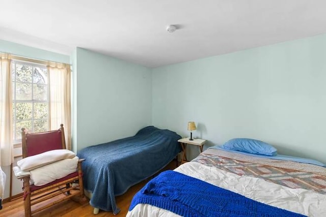 bedroom with hardwood / wood-style floors