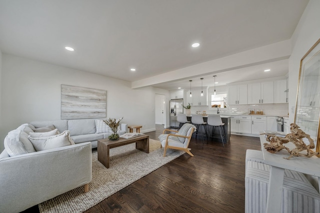 living room with dark hardwood / wood-style flooring