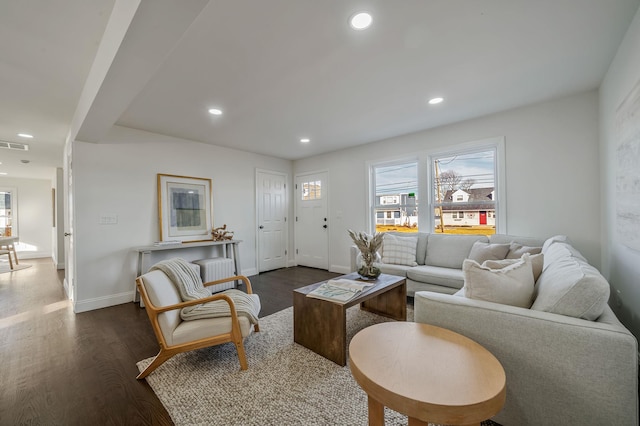 living room with dark hardwood / wood-style flooring