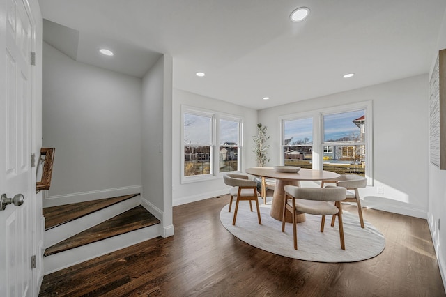 dining area with dark hardwood / wood-style flooring