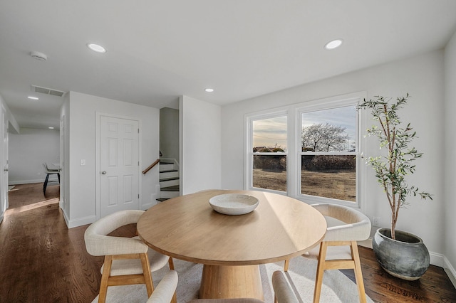 dining area featuring dark hardwood / wood-style flooring