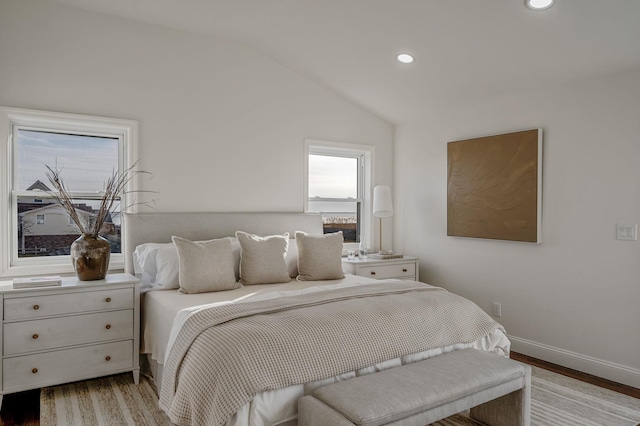 bedroom featuring light hardwood / wood-style flooring and vaulted ceiling