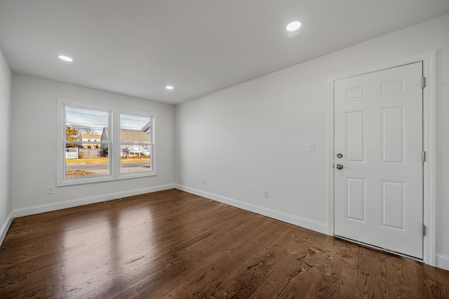 spare room featuring dark hardwood / wood-style flooring