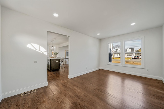 empty room featuring dark hardwood / wood-style floors