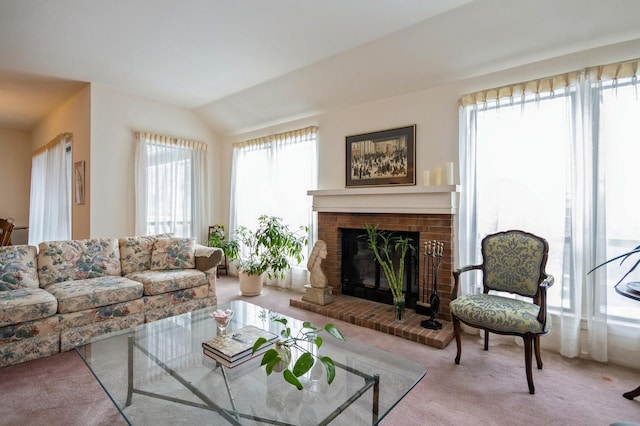 living room with light carpet, a fireplace, and lofted ceiling