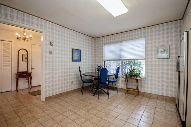 dining room featuring light tile patterned floors, an inviting chandelier, ornamental molding, baseboards, and wallpapered walls