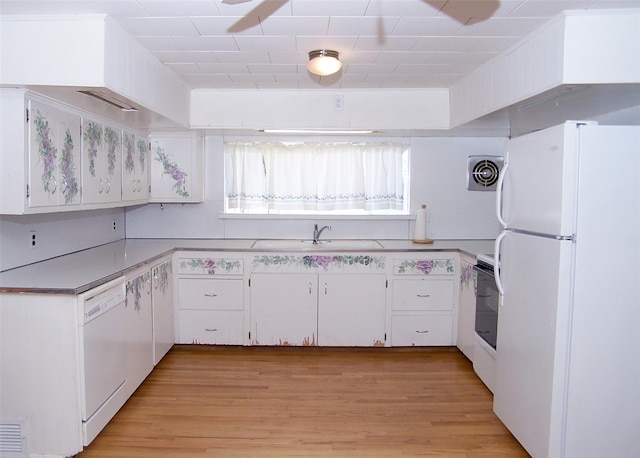 kitchen with white cabinetry, sink, white appliances, and light hardwood / wood-style floors