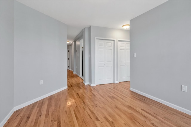 unfurnished room with light hardwood / wood-style floors