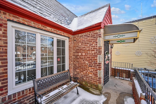 view of snow covered property entrance