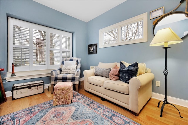 living room with a wealth of natural light and hardwood / wood-style floors