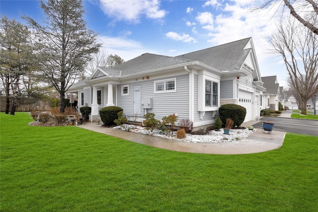 exterior space featuring a garage and a lawn